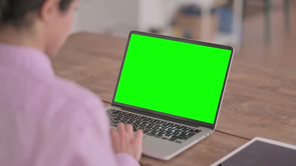 Indian Woman using Laptop with Green Screen alt
