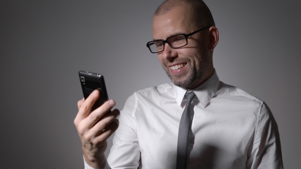 Friendly Middle Manager Communicates With Partners Via Online Chat. Smartphone With Internet Access alt