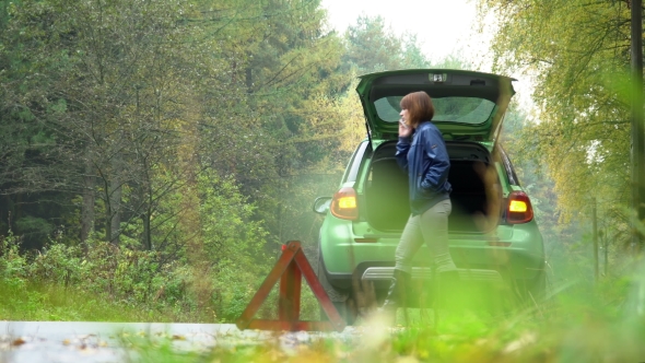 The Woman Making Emergency Call To Recovery Services With Broken Car alt