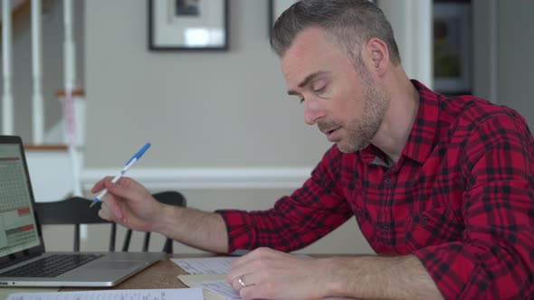 Working Class Man Struggles with Taxes alt