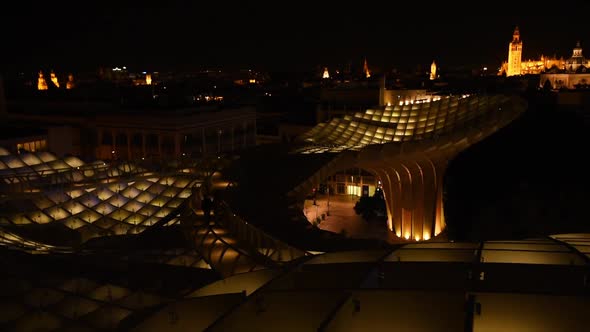 Magical nighttime illumination on the Setas de Sevilla. Aurora Experience and the skyline of Sevilla alt