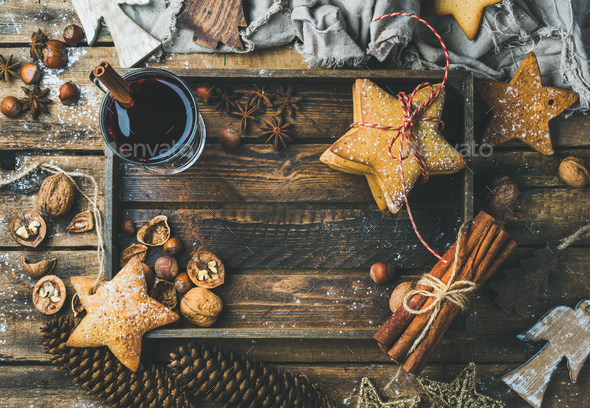 Glass of mulled wine, gingerbread cookies and spices, copy space - Stock Photo - Images