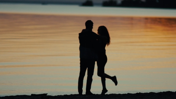 Romantic Couple In Love. Boy And Girl Kissing At Sunset.