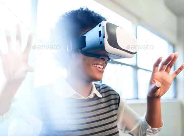 Cool millennial black woman exploring virtual reality glasses in - Stock Photo - Images