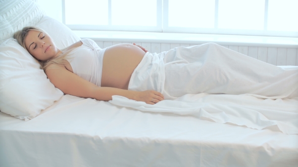 Pregnant Young Woman Sleeping