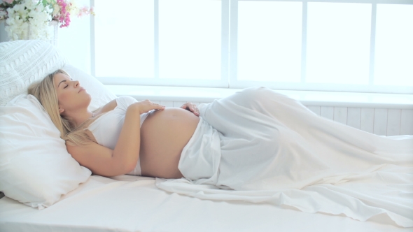 Pregnant Young Woman Sleeping