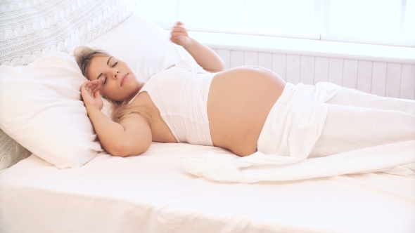 Pregnant Woman Wakes Up In The Morning