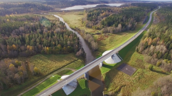 Beautiful Aerial View Of Road Bridge with car Over The River Surrounded By Forest