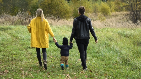 Young Family On a Walk In The Park alt