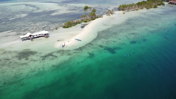 Perishing Island With Crystal Clear Ocean Water Drone Footage