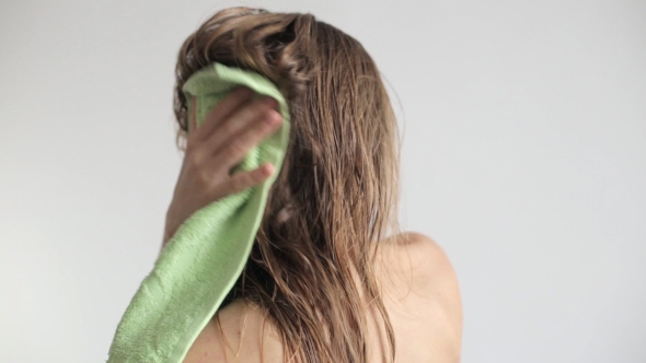 Blonde Woman Wipes Her Hair