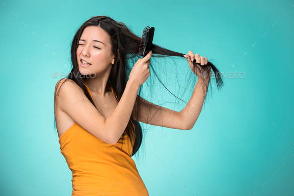Frustrated young woman having a bad hair