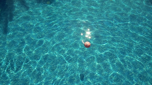 Beach Ball Floating In Pool