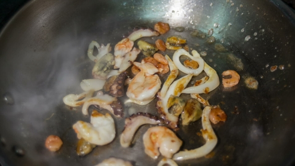 Frying Seafood On The Hot Pan