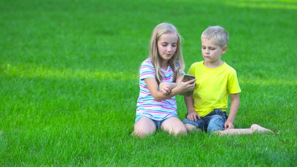 Children With Smart Phone Ooutside