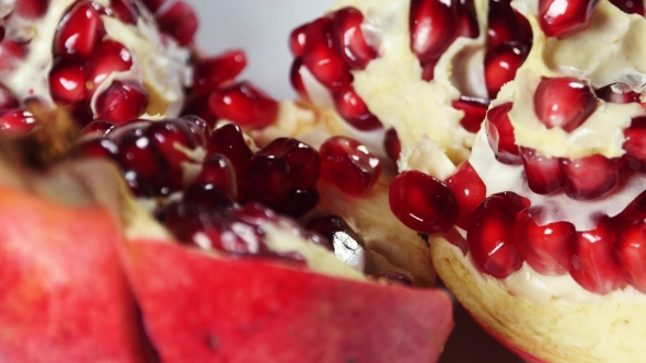 Opened Pomegranate Detail With Beautiful Red Fleshy Seeds alt