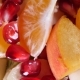 Top View Of a Fruit Salad With Mandarin, Oranges, Kiwi, Pomegranate Seeds, Figs, Banana And Peaches - VideoHive Item for Sale