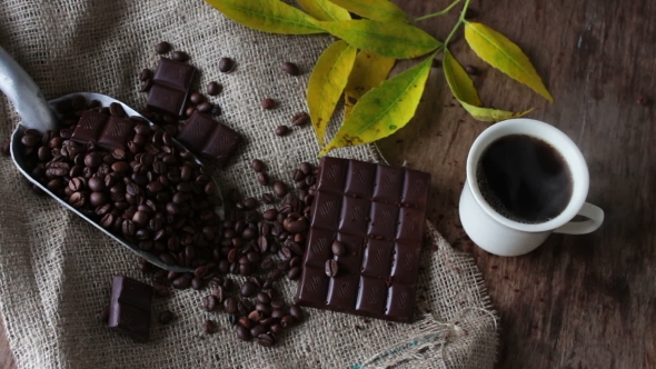 Coffee Grains Chocolate and Cup of Coffee alt