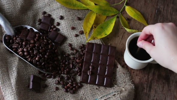 Female Hand Stirs With Spoon Fragrant Hot Coffee In White Cup alt