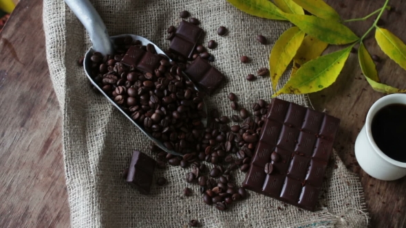Coffee Grains Chocolate And Cup Of Coffee alt