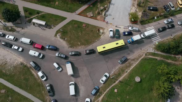 Aerial Drone Flight Top Down View of Stuck Cars and Buses on Crossroad at Rush Hour Heavy Traffic