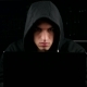 Hacker In a Hooded Working On a Computer In a Dark Office Room - VideoHive Item for Sale