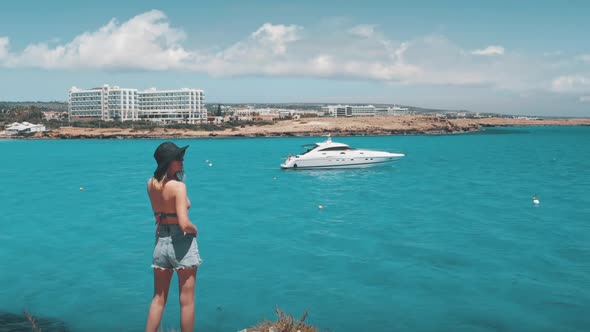 Female Travel Blogger Tourist Enjoy Beautiful Nature Landscape View of Seaside Coast in Ayia Napa alt