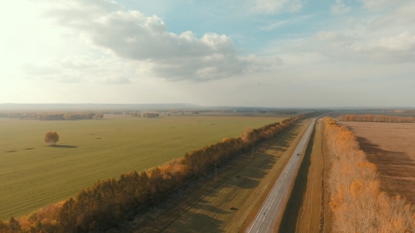Aerial Shot Of a Rural Road. Country Road And Field.