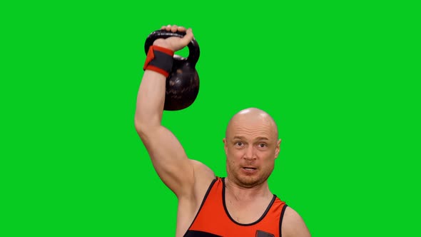 Male Athlete Exercising Single Arm Kettlebell Push Up on Green Screen