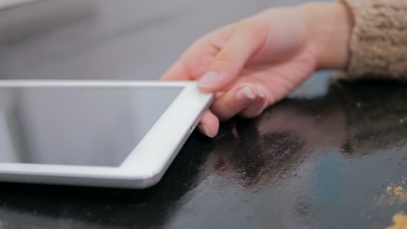 Woman's Hand Plugging Black Lightning Charging Cable Into Pc Digital Tablet