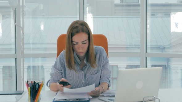 Young Business Woman At Desk With Phone And Computer In Modern Office. alt