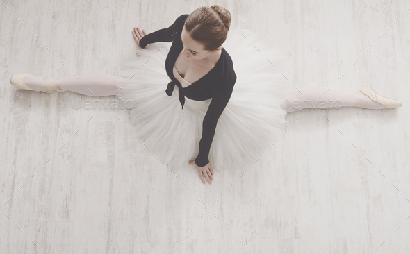 Classical Ballet dancer in split portrait, top view