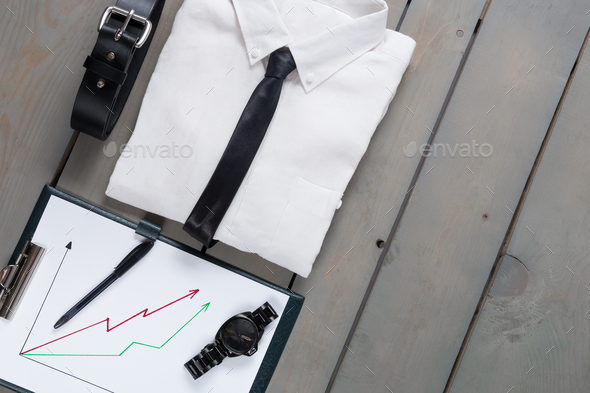 Businessman, work outfit on grey wooden background