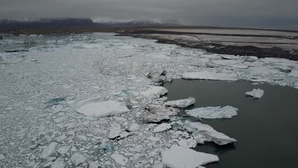 Aerial cloudy white ice land