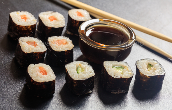 Sushi rolls on a black surface Stock Photo by rawf8 | PhotoDune