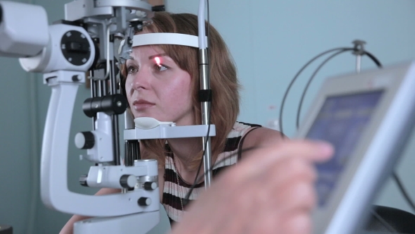 Modern Medical Procedure. Ophthalmologist Points At Touchscreen During Eye Examining. alt