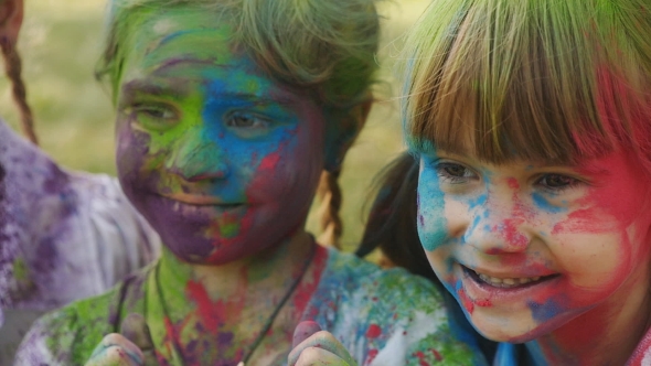 Cute European Child Girls Celebrate Indian Holi Festival With Colorful Paint alt