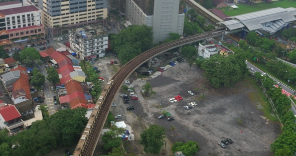 Daytime Panorama Of City Kuala Lumpur, Malaysia With Railway With a Passing Train alt