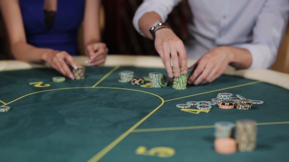 Group of People In Underground Casino Bet