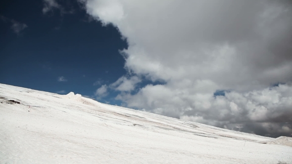 Snowy Mountain Tops And Clouds