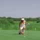 Woman Stands On Her Knee At The Golf - VideoHive Item for Sale