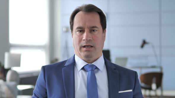 Sad Businessman Feeling Upset for Loss alt