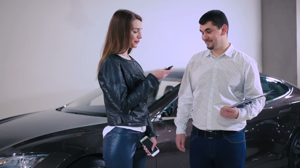 The Manager Talking With Woman About Car Keys alt