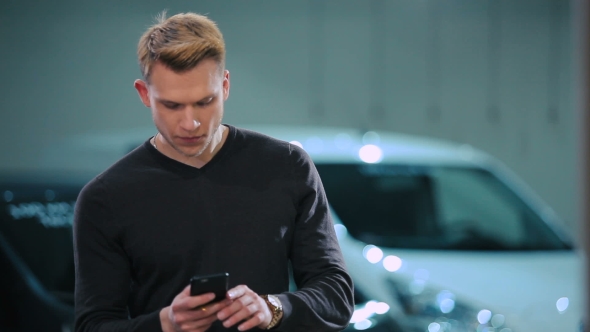 Man Calling On The Phone And Look At The Watch alt