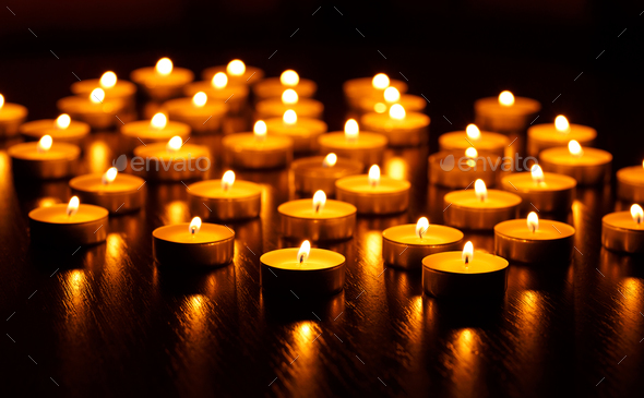 Many burning candles with shallow depth of field - Stock Photo - Images