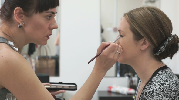 Makeup Artist Making Make-up For Young Model