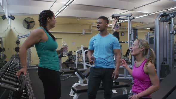 Group of people talking together at gym