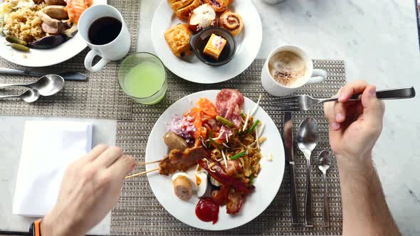 Top View of Morning Eating From Plates Full of Fresh Food on the Table alt