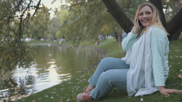 Woman Plus Size Sit On Lake Bank Park Background