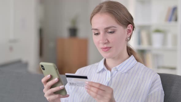Portrait of Successful Online Payment on Smartphone By Young Woman alt